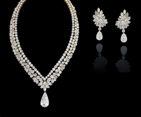 A SET OF DIAMOND JEWELLERY, BY CARTIER | Christie's