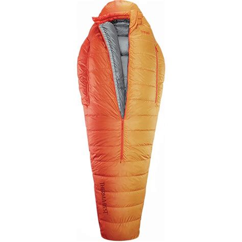 an orange sleeping bag with the hood up and zippered down on it's side