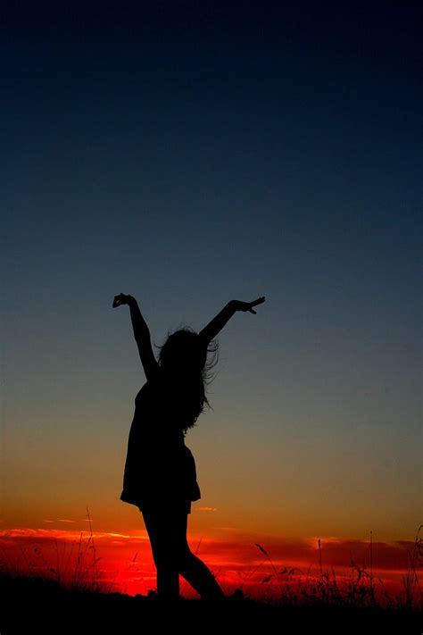 Royalty-Free photo: Photography of woman raising her hands during sunset | PickPik