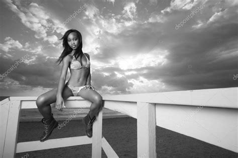 Woman sitting on the ledge — Stock Photo © felixtm #5174245