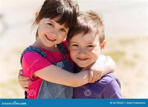 Two Happy Kids Hugging Outdoors Stock Photo - Image: 56720535