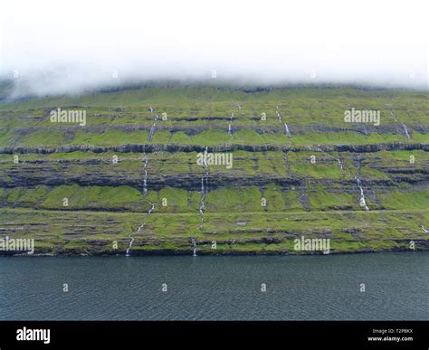 many waterfalls on Faroe Islands Stock Photo - Alamy