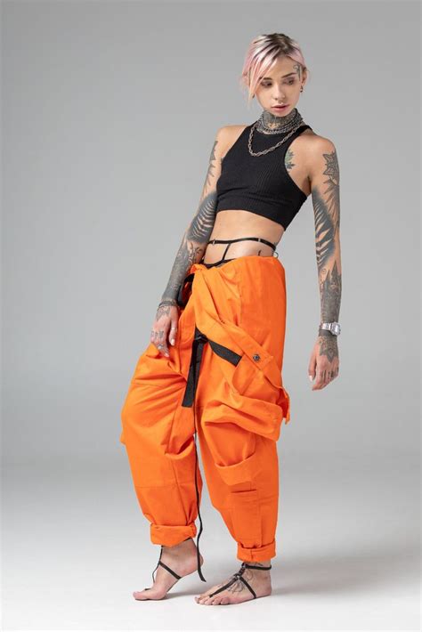 Orange one piece pantsuit, matching couple look, futuristic style mechanic pilot costume, men ...