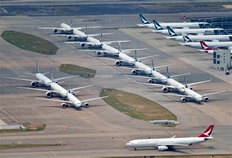 Airplanes in parking formation at Hong Kong International Airport while unused during this ...