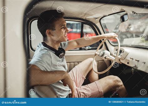 A Young and Attractive Man is Driving a Vintage Car Stock Image - Image of vehicle, wealthy ...