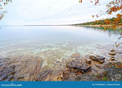 Quiet Waters on a Lake Shore in the Fall Stock Photo - Image of water, nature: 107042842