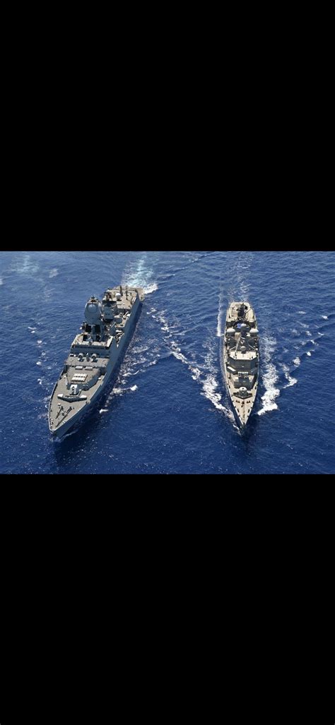 Indian navies VISAKHAPATNAM CLASS destroyer(left) sailing with a Greek ...