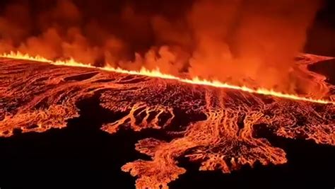 Fast-travelling molten lava flows metres from Iceland defence barriers ...