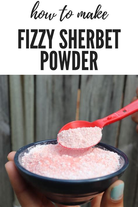 a person holding a bowl with pink powder in it and the words how to make fizzy sherbet powder