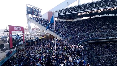 Steve Largent raising the 12th man flag at the Seahawks-Buccaneers game ...