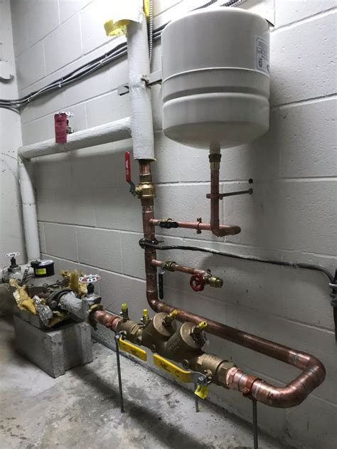 pipes and piping in a room with white walls