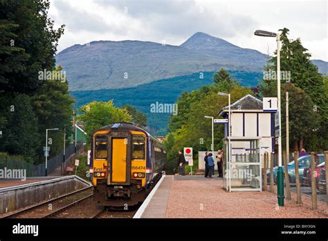 Scotrail Class 156 DMU leaving Taynuilt Railway station in Argyll & Bute Scotland with Ben ...