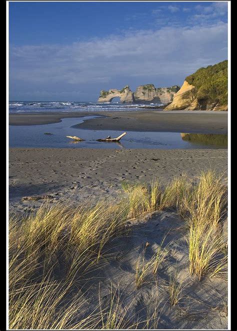 Wharariki Beach. 20 min walk from carpark or 1 hr walk across sand dunes from Takaka. Caves and ...