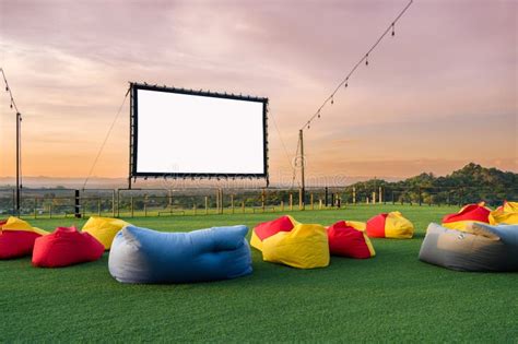 Open Air Cinema with Colorful Bean Bag. Empty White Screen, Free Space ...