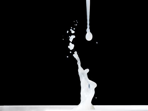 Milk Splash on black background. 10723706 Stock Photo at Vecteezy