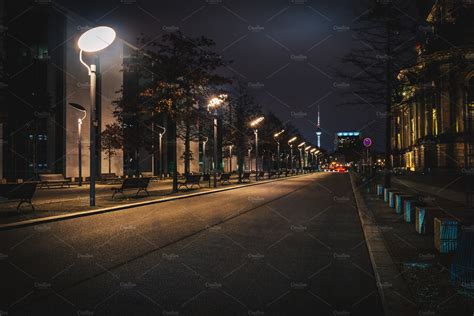 Long empty city street at night | Architecture Stock Photos ~ Creative Market