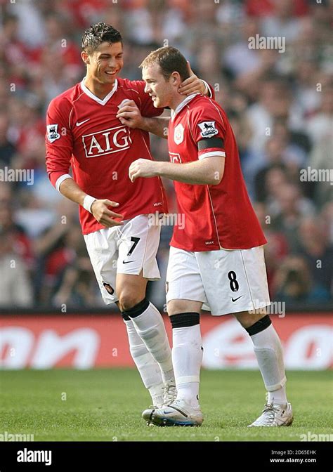 Manchester United's Wayne Rooney is congratulated by his team mate ...