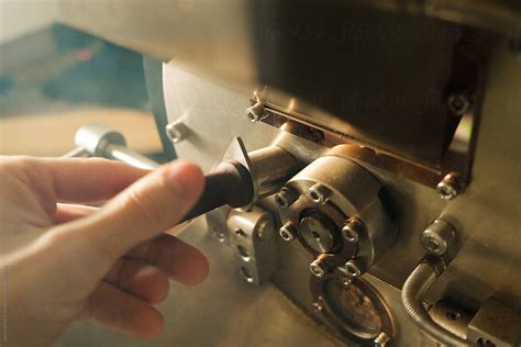 Roasting coffee using a manual machine - Stock Image - Everypixel