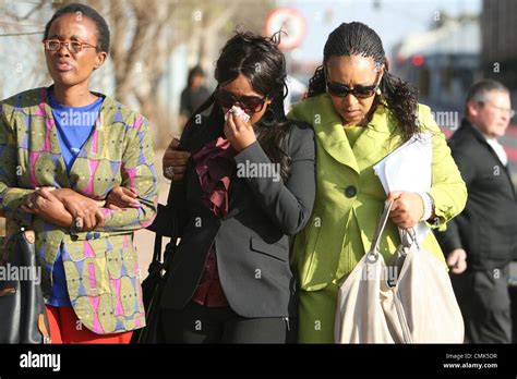 JOHANNESBURG, SOUTH AFRICA: Zenani Mandela (R) comforts her daughter ...