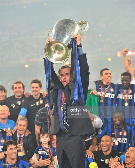 Inter Milan Coach Jose Mourinho lifts the trophy in celebration during ...