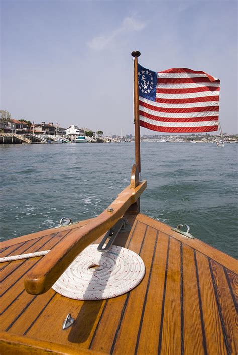 American Flag On The Bow Of Boat Photograph by James Forte