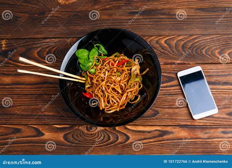 Chinese Food in a Plate on a Brown Wooden Table. Stock Photo - Image of focus, cell: 101722766