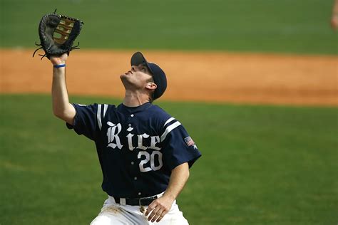 A baseball glove and a baseball on a baseball field · Free Stock Photo