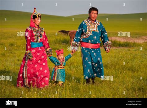 Mongolian couple with child, Xilin Gol Grassland, Xilinhot, Inner Mongolia Autonomous Region ...