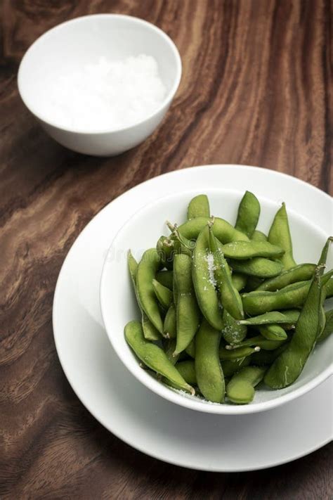 Edamame Beans Snack in Bowl on Table with Sea Salt Stock Photo - Image of salted, vegan: 182325494