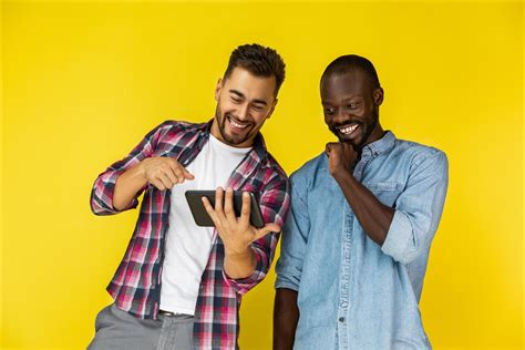 Two friends laughing at a video 1486594 Stock Photo at Vecteezy