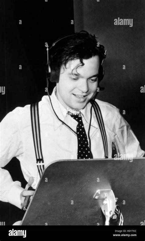 Orson Welles, directing the historic 'War of the Worlds' radio ...