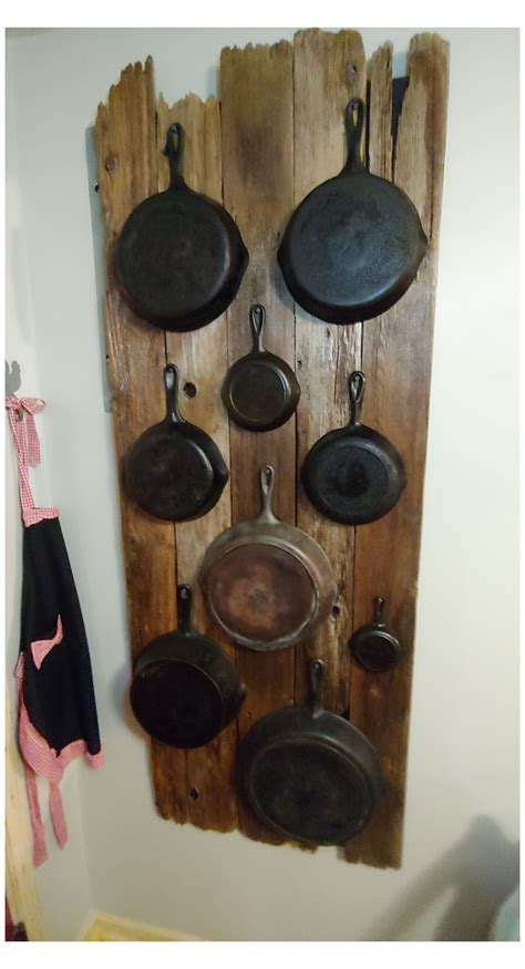 Displaying Your Cast Iron Skillets #cookware #display #cookwaredisplay This Barn Wood was nailed ...