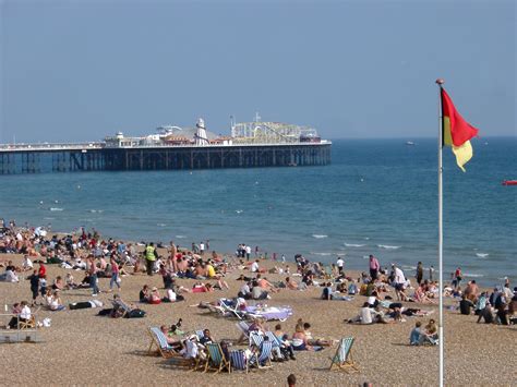 Free Stock photo of Tourists Relaxing at Seaside Near Brighton Pier ...