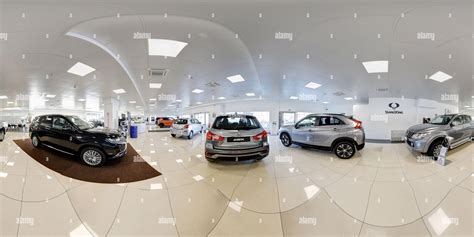 360° view of 360 degree panorama of a new car dealership showroom with assorted models of ...