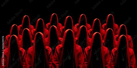 People dressed in a red robes looking like a cult members on a dark ...