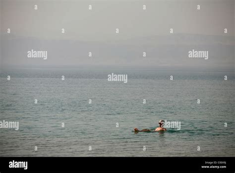 People floating on the dead sea, Jordan Stock Photo - Alamy