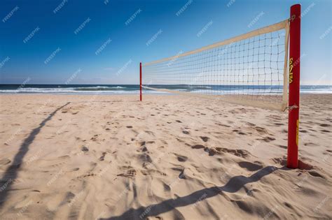 Premium AI Image | A volleyball net on a beach with the ocean in the ...