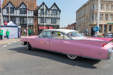 Side View of Vintage Pink Cadillac with Old British Buildings in the Background Editorial ...