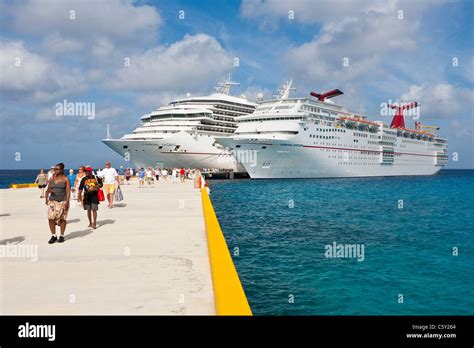 Cruise ship passengers on pier disembarking from cruise ships in Cozumel, Mexico in the ...