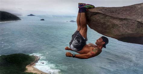 This photo of a man hanging off a cliff is not what you think it is ...