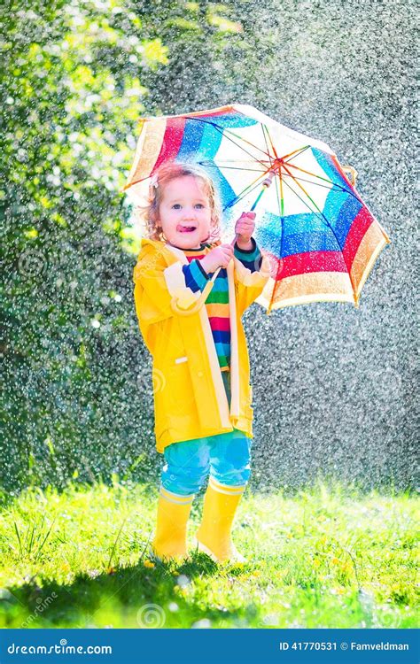 Little Toddler with Colorful Umbrella Playing in Rain Stock Image - Image of blue, portrait ...