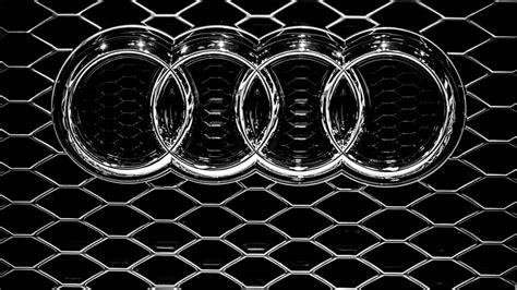 Audi emblem on a grille - Metal logo wallpaper