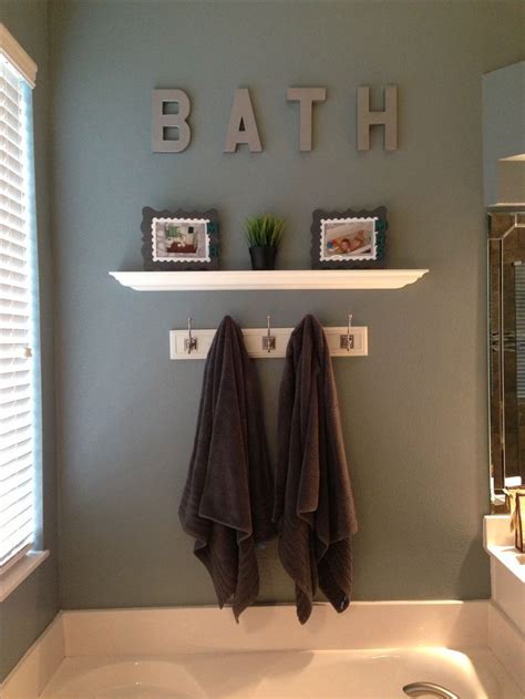 20 Wall Decorating Ideas For Your Bathroom - Housely | Brown bathroom decor, Small bathroom ...