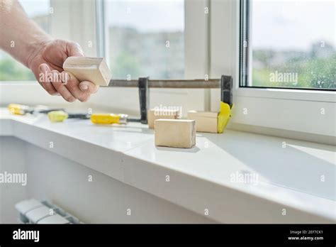 Artificial stone window sill, installation, technological process Stock Photo - Alamy