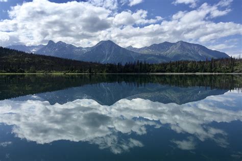 A mirror-like Lake Clark reflects the scenery, Lake Clark National Park ...