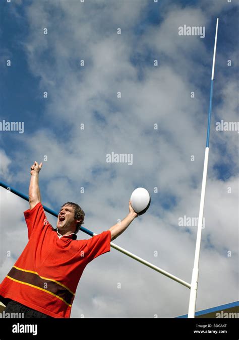 Rugby player celebrating Stock Photo - Alamy