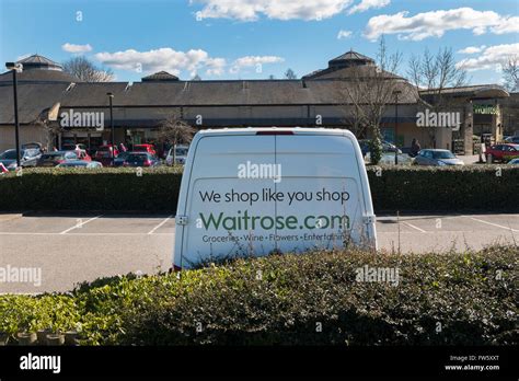 Waitrose supermarket delivery van parked in the car park in Cirencester, Gloucestershire, UK ...