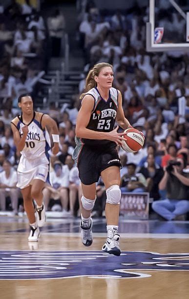 Sue Wicks #23 (right) of the New York Liberty runs with the ball during ...