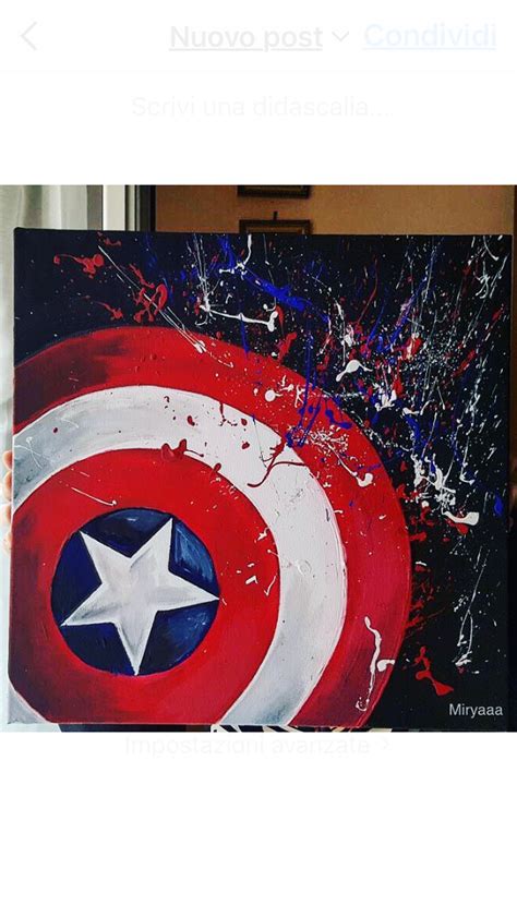 the captain's shield is painted in red, white and blue with paint splatters on it
