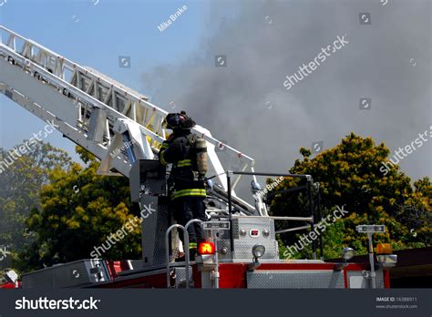 Fireman Controlling Fire Engine Ladder Stock Photo 16388911 : Shutterstock